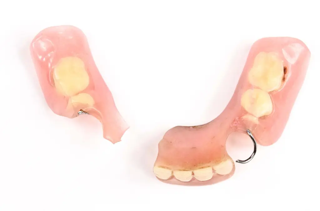 Dental technician repairing a denture at Chrome Cast Dental Laboratory